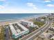 Aerial view of a beachfront resort with swimming pool and access to beach, highway and ocean in Daytona Beach, Florida at 935 S Atlantic Ave # 505, Daytona Beach, FL 32118
