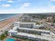 Aerial view of a beachfront resort with swimming pool, ocean views, and nearby highway access in Daytona Beach, Florida at 935 S Atlantic Ave # 505, Daytona Beach, FL 32118