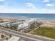 Aerial view of a beachfront resort with palm trees and ocean view in Daytona Beach, Florida at 935 S Atlantic Ave # 505, Daytona Beach, FL 32118