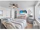 Bedroom featuring two beds, a TV, a mini fridge, and nautical decor for a relaxing stay at 935 S Atlantic Ave # 505, Daytona Beach, FL 32118