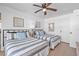 Bedroom featuring two twin beds with blue and white striped bedding and nautical decor at 935 S Atlantic Ave # 505, Daytona Beach, FL 32118