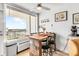 Cozy dining area with unique table, chairs, and a view from the balcony at 935 S Atlantic Ave # 505, Daytona Beach, FL 32118