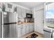 Efficient kitchen with stainless steel appliances and butcher block countertops at 935 S Atlantic Ave # 505, Daytona Beach, FL 32118
