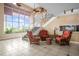 Lobby featuring three chairs, artwork, a staircase, and a wall mural at 935 S Atlantic Ave # 505, Daytona Beach, FL 32118
