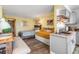 Bright living space with kitchenette offers a cozy dining area, bed, and modern finishes at 935 S Atlantic Ave # 511, Daytona Beach, FL 32118