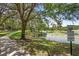 Scenic community featuring a walking path near a pond and lush trees, creating a peaceful environment at 980 Marjorie Rawlings Dr, Deland, FL 32720