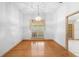 Dining room with hardwood floors and a large window at 980 Marjorie Rawlings Dr, Deland, FL 32720