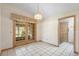 Sunny dining room boasts french doors to the screened porch and outdoor living spaces at 980 Marjorie Rawlings Dr, Deland, FL 32720