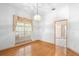 Dining room featuring hardwood floors and a large window at 980 Marjorie Rawlings Dr, Deland, FL 32720