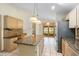 Charming kitchen features stainless steel appliances, granite counters, and a functional island at 980 Marjorie Rawlings Dr, Deland, FL 32720