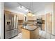 Charming kitchen features stainless steel appliances, granite counters, and a functional island at 980 Marjorie Rawlings Dr, Deland, FL 32720