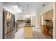 Charming kitchen features stainless steel appliances, granite counters, and a functional island at 980 Marjorie Rawlings Dr, Deland, FL 32720