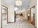 View of the kitchen with stainless steel refrigerator, island, and tile flooring at 980 Marjorie Rawlings Dr, Deland, FL 32720