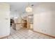 Bright eat-in kitchen featuring tile floors, kitchen island, and breakfast nook at 980 Marjorie Rawlings Dr, Deland, FL 32720