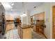 Charming kitchen features stainless steel appliances, granite counters, and a functional island at 980 Marjorie Rawlings Dr, Deland, FL 32720