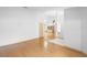 Bright and open living area with hardwood floors and view of adjacent room at 980 Marjorie Rawlings Dr, Deland, FL 32720