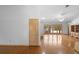 Open-concept living room featuring hardwood floors, natural light, and sliding glass doors to the backyard at 980 Marjorie Rawlings Dr, Deland, FL 32720