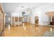 Bright living room boasts hardwood floors, built-in shelving, and seamless flow to other areas at 980 Marjorie Rawlings Dr, Deland, FL 32720