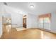 Spacious living area featuring wood flooring, window and view of entry at 980 Marjorie Rawlings Dr, Deland, FL 32720