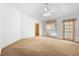 Large bedroom with carpet, ceiling fan, and natural light at 980 Marjorie Rawlings Dr, Deland, FL 32720