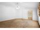 Spacious main bedroom with carpeting and an ensuite bathroom at 980 Marjorie Rawlings Dr, Deland, FL 32720