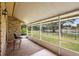 Enjoy the outdoors in this screened porch with views of the fenced backyard at 980 Marjorie Rawlings Dr, Deland, FL 32720