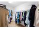 Spacious walk-in closet featuring ample storage with installed shelving and clothing racks at 980 Marjorie Rawlings Dr, Deland, FL 32720