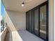 Balcony with sliding doors leading to the interior of the condo at 1 Oceans West Blvd # 2A1, Daytona Beach, FL 32118