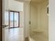 Bathroom boasts a stand in shower with safety bars and a view to the balcony at 1 Oceans West Blvd # 2A1, Daytona Beach, FL 32118
