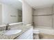 Updated bathroom featuring granite countertops and tiled shower at 1 Oceans West Blvd # 2A1, Daytona Beach, FL 32118