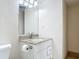 Bathroom vanity features a granite countertop and classic white cabinetry at 1 Oceans West Blvd # 2A1, Daytona Beach, FL 32118