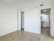 Bedroom with views into the bathroom and hall at 1 Oceans West Blvd # 2A1, Daytona Beach, FL 32118