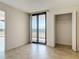 Light filled bedroom with lanai access and closet space at 1 Oceans West Blvd # 2A1, Daytona Beach, FL 32118