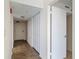Entryway hallway featuring tiled floors, a utility closet, and access to the unit at 1 Oceans West Blvd # 2A1, Daytona Beach, FL 32118
