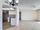 Living area with an open kitchen, granite countertops, and stainless-steel appliances at 1 Oceans West Blvd # 2A1, Daytona Beach, FL 32118