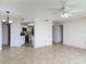 Comfortable living space flows into a renovated kitchen with granite countertops at 1 Oceans West Blvd # 2A1, Daytona Beach, FL 32118