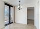Bright living area with balcony access and an open layout to the dining area at 1 Oceans West Blvd # 2A1, Daytona Beach, FL 32118
