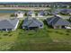 The aerial view showcases the home's backyard with pond views within a well-planned community at 1000 Megano Blvd, Deland, FL 32724