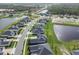 The aerial view shows the property’s location on a street with access to community amenities at 1000 Megano Blvd, Deland, FL 32724