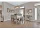 Charming dining area featuring a stylish table setting, elegant decor, and ample natural light at 1000 Megano Blvd, Deland, FL 32724