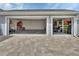 Spacious three car garage with epoxy floors, offering ample storage space and parking at 1000 Megano Blvd, Deland, FL 32724
