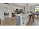 Kitchen island with granite countertops and stainless steel appliances in an open concept home at 1000 Megano Blvd, Deland, FL 32724
