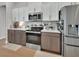 Modern kitchen featuring stainless steel appliances, granite countertops and two-tone cabinets at 1000 Megano Blvd, Deland, FL 32724