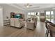 Inviting living room featuring comfortable seating, a large window view, and stylish decor at 1000 Megano Blvd, Deland, FL 32724