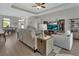 View of the living room flowing into dining space and a beautifully decorated and welcoming interior at 1000 Megano Blvd, Deland, FL 32724