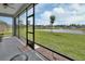 Screened patio features a lovely view of the community pond and meticulously maintained lawn at 1000 Megano Blvd, Deland, FL 32724