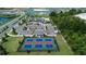 Aerial view of well-maintained pickleball courts, with amenities and parking nearby at 1000 Megano Blvd, Deland, FL 32724