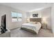 Comfortable bedroom with stylish upholstered headboard, carpet floors, and mirrored nightstands at 1002 River Falls Cir, Deland, FL 32720