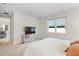 Relaxing bedroom features a large window, carpet, and dresser with TV at 1002 River Falls Cir, Deland, FL 32720