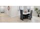 Chic dining area showcasing a modern table setting, wood floors, and natural light at 1002 River Falls Cir, Deland, FL 32720